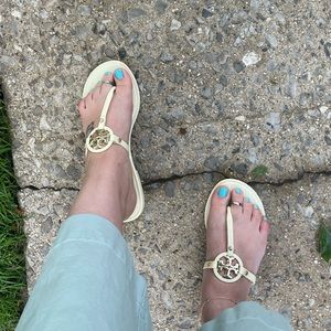 Tory Burch cream flip flops